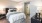 spacious, carpeted bedroom