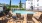 a pool with chairs around it