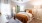 a bedroom with a fan and a bed