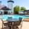 table and chairs near pool